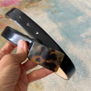 Black belt with tortoise shell buckle